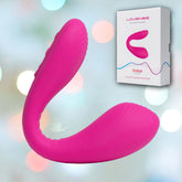 A pink Lovense Dolce G-Spot and Clitoral Stimulator, featuring a textured surface and flexible design, is shown against a blurred multicolored background. The packaging box, labeled with the brand name "Lovense" and displaying an image of the vibrator, is positioned at the top right.